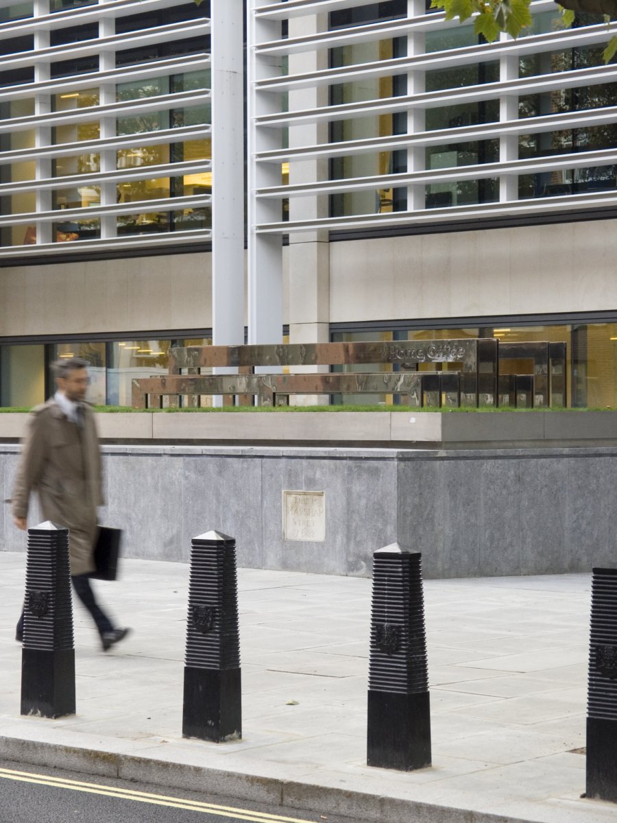 Image of Signature Sculpture to right of entrance of Home Office building