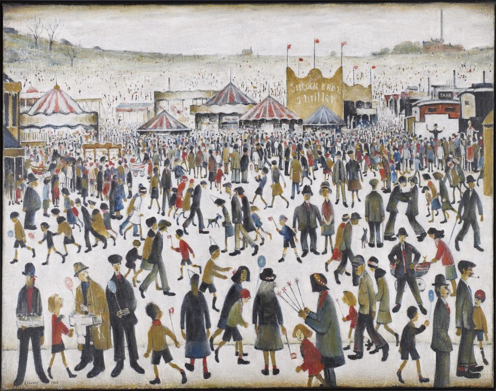 Crowd scene of people at a funfair