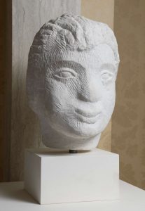 Stone sculpture of a boy's head