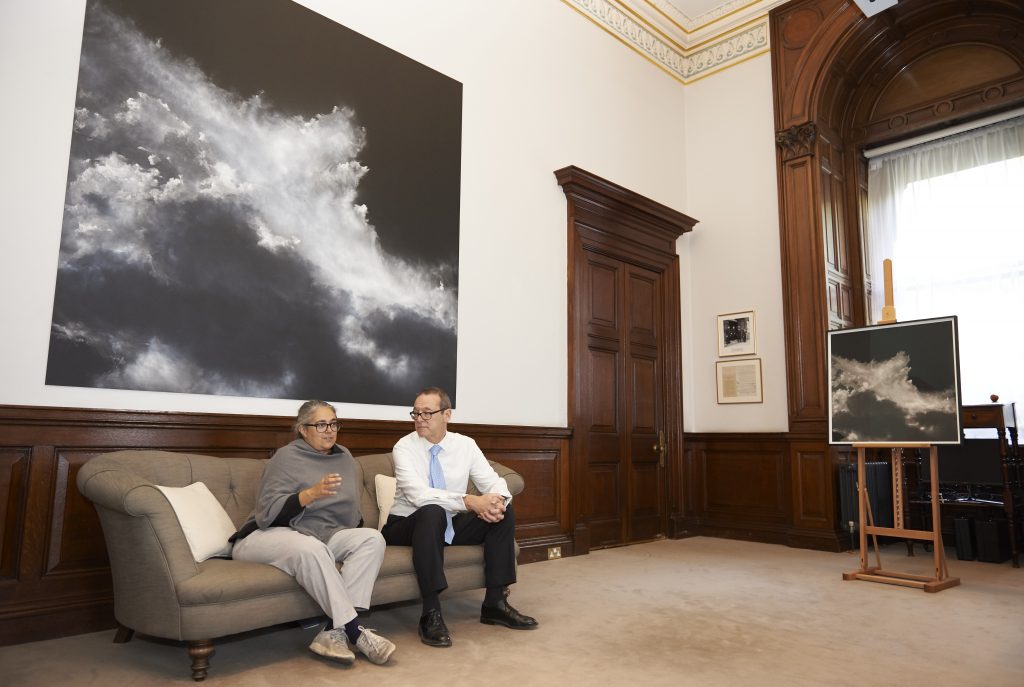 Tacita Dean and Sir Simon McDonald sitting in his office