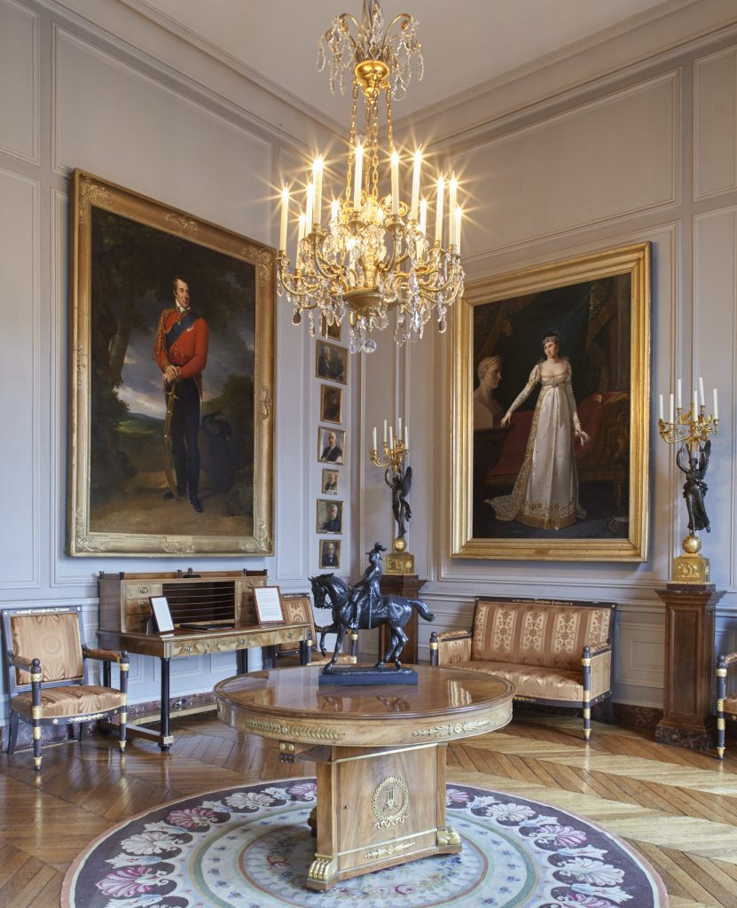 Two portrait paintings shown in a room at the British Embassy, Paris