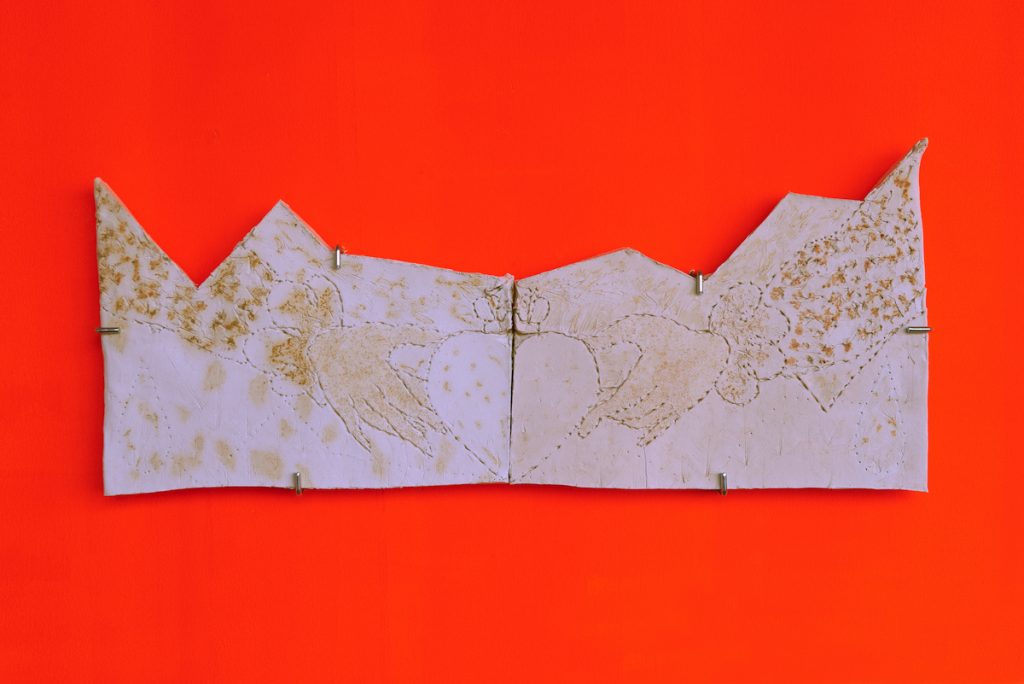 A slab of concrete against an orange background