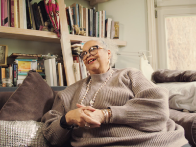 A screenshot from an interview of artist Rita Keegan in her home